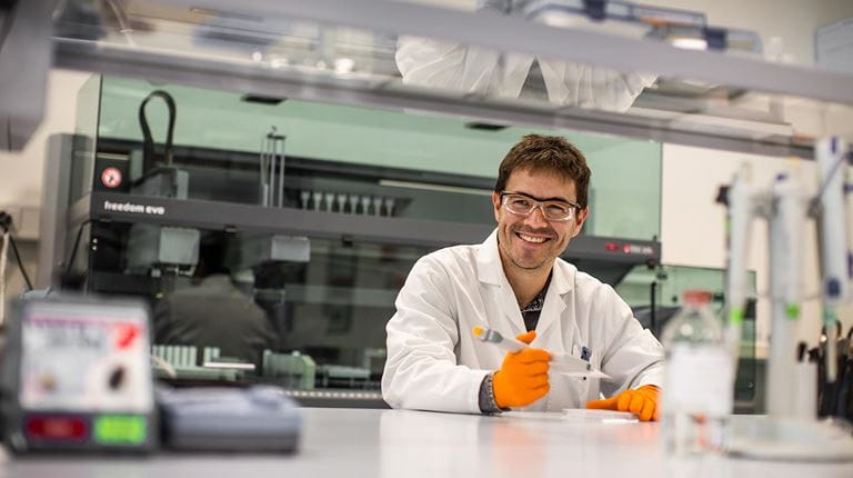 Researcher smiling