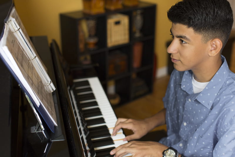 boy playing piano